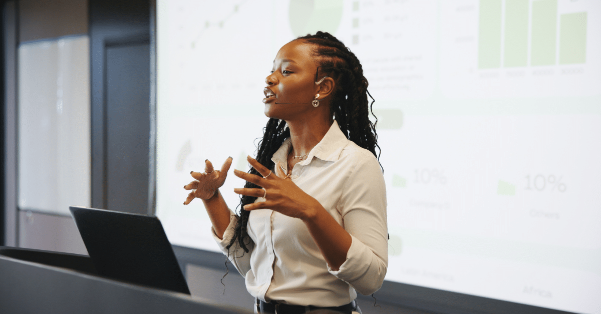 Image of woman presenting at work.